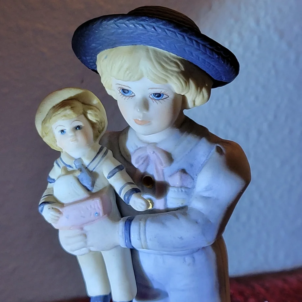 VINTAGE PORCELAIN BOY WITH DOLL FIGURINE 